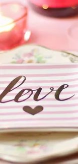 Pink striped wallpaper with love script and heart design.