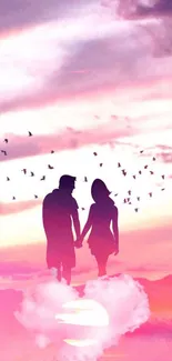 Romantic couple silhouette at pink sunset with birds in the sky.