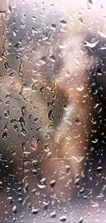 Romantic couple behind rain drop glass wallpaper.