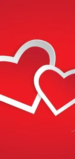 Two white hearts on a red background wallpaper.