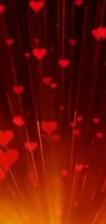 Red hearts rain down on fiery background, creating a romantic mobile wallpaper.