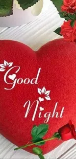 Red heart with 'Good Night' text and roses on wooden surface.