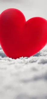 Red heart on snowy white background mobile wallpaper.