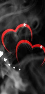 Elegant wallpaper with red hearts on black smoky background.