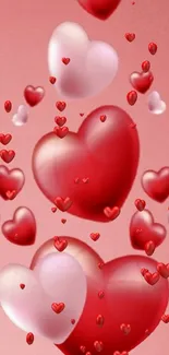 Romantic mobile wallpaper with floating red hearts on a pink background.