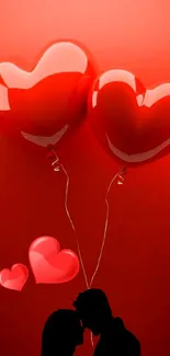 Heart-shaped balloons with a silhouetted couple on red background.