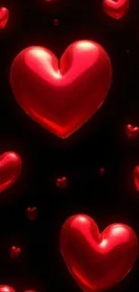 Mobile wallpaper with red hearts on black background.