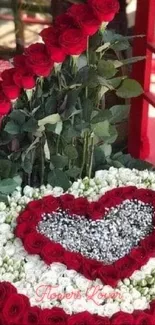 Heart-shaped red rose floral arrangement in a romantic display.