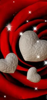 Red rose with stone hearts and starry accents wallpaper.
