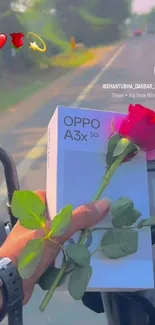 Person holding a rose and a gift on a motorbike ride.