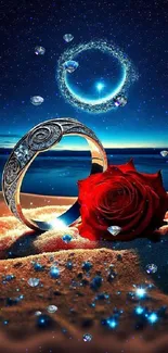 Silver ring with red rose on sandy beach under starry sky.