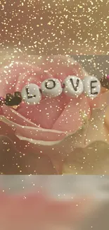 Romantic wallpaper with pink rose and 'LOVE' beads.