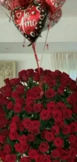 Bouquet of red roses with love balloons.