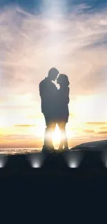 Romantic couple silhouette at seaside sunset with vibrant sky.