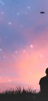 Silhouette couple at sunset with stars in the sky wallpaper.