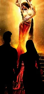 Romantic silhouette of a couple with vibrant fiery background.