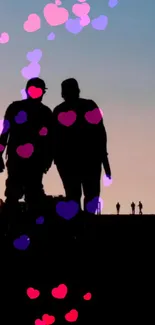 Silhouette of couple at sunset with floating hearts in romantic mobile wallpaper.