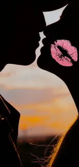 Silhouette of a couple kissing at sunset with a pink kiss mark.