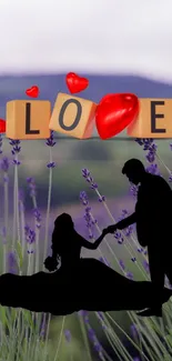 Silhouette couple with love blocks in lavender field.