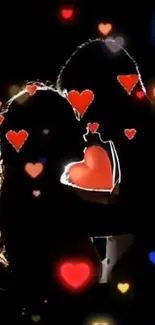 Silhouette of a couple with hearts.