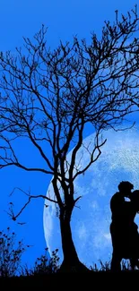 Couple kissing beneath a moonlit tree.