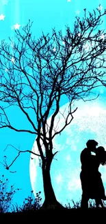 Silhouette of a couple under a tree with a blue moonlit background.