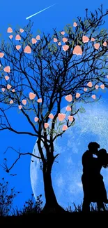 Silhouette of a couple under a blossoming tree against a blue moonlit sky.