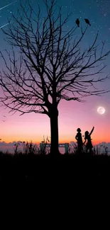 Silhouette of a couple under a starry night sky with a sunset.