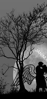 Silhouette couple with angel wings under a moonlit night sky.