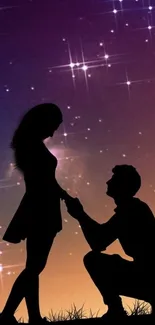 Silhouette of couple under a starlit night sky.