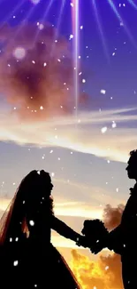 Silhouette of a couple under a colorful sunset sky with falling snowflakes.