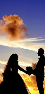 Silhouetted couple at sunset against a vibrant blue-orange sky.