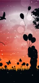 Silhouette of trees and balloons against an orange sunset sky.