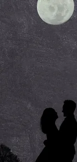 Silhouette of a couple under a bright full moon in a night sky wallpaper.