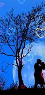 Couple silhouetted against a blue moonlit night.