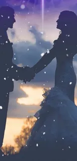 Romantic couple silhouette at sunset with falling snowflakes.