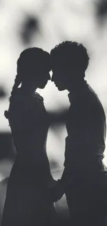 Romantic couple silhouette in grayscale wallpaper for mobile phone.