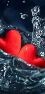 Two red hearts splash in water against a dark blue background.