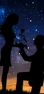 Silhouette of couple proposing under a starry night sky.