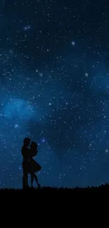 Silhouette of a couple under a starry night sky in dark blue hues.