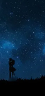 Silhouette of couple under a starry night sky.