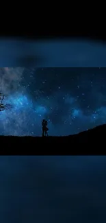 Couple silhouette under a starry night sky with galaxy view.