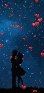 Silhouetted couple under a starry galaxy night sky.