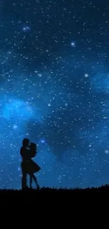 Romantic couple silhouette under a starry night sky.