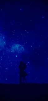 Silhouette couple under a starry night sky wallpaper.