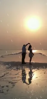 Couple dancing on beach at sunset with serene reflections.