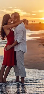 Couple kissing on beach during romantic sunset.