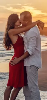 Romantic couple kissing at sunset beach with ocean backdrop.