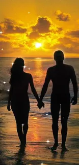 Silhouette of a couple on a warm sunset beach.