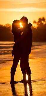 Romantic couple kissing at sunset on a beach.